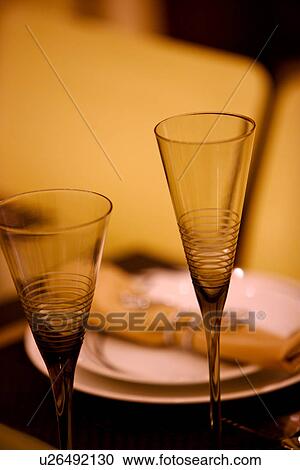 Stock Image - Place setting with wineglasses. Fotosearch