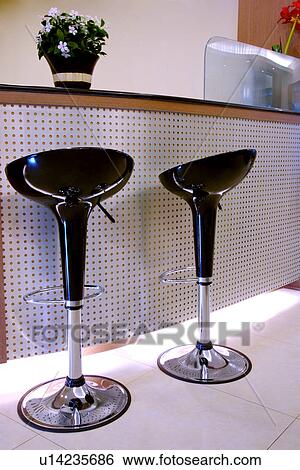 Stock Photograph - Two stools by counter. Fotosearch