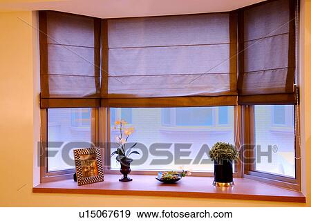 Stock Photo - Window sill with flower and picture flame. Fotosearch