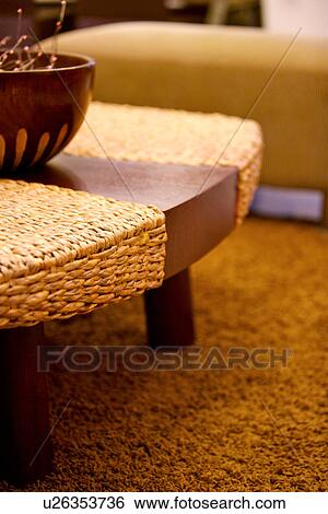 Stock Photograph - Woven table on rug. Fotosearch