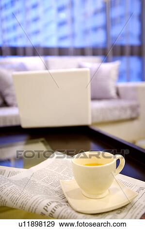 Stock Photo - A cup of tea in living room. Fotosearch