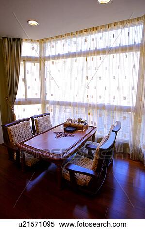 Dining table by window View Large Photo Image Stock Photography - Dining table by window. Fotosearch