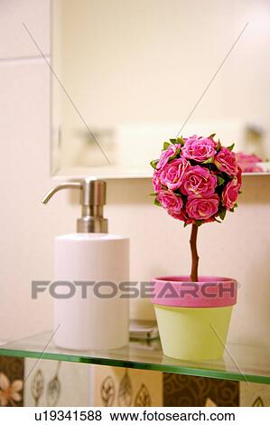 Grooming product and flower pot with flowers View Large Photo Image Stock Photo - Grooming product and flower pot with flowers. Fotosearch