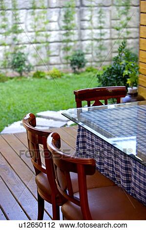 Stock Image - Patio dining area. Fotosearch