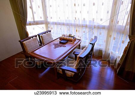 Stock Image - Table near french window. Fotosearch