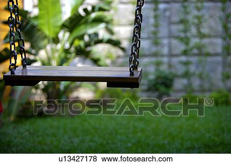 Wooden swing View Large Photo Image Stock Photo - Wooden swing. Fotosearch