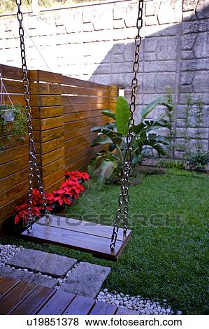 Stock Photo - Wooden swing. Fotosearch
