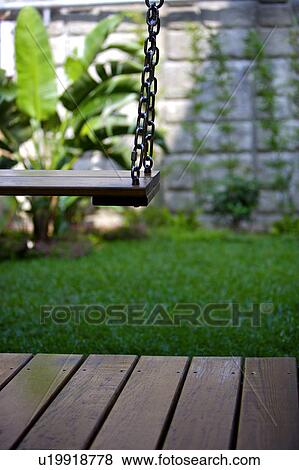 Wooden swing View Large Photo Image Stock Photo - Wooden swing. Fotosearch