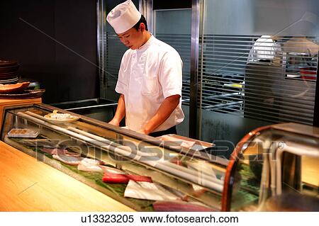 Stock Photography - Chef working in restaurant. Fotosearch
