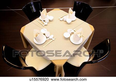 Stock Image - Table setting in chinese restaurant. Fotosearch