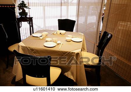 Stock Image - Table setting in restaurant. Fotosearch