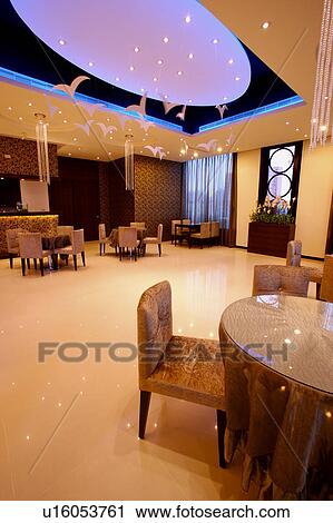 Stock Image - Tables in restaurant. Fotosearch