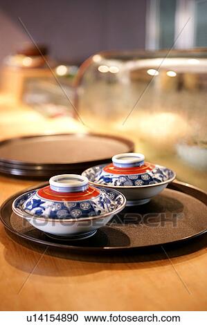 Stock Image - Tray with small bowls on table. Fotosearch