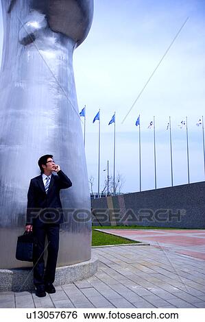 Stock Photograph - Young businessman on the phone. Fotosearch