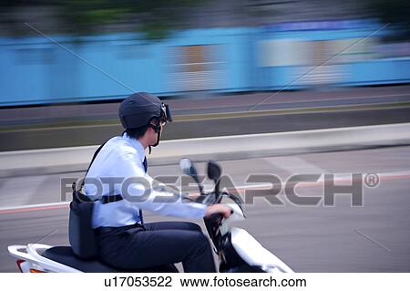 Young businessman riding motorcycle View Large Photo Image Stock Image - Young businessman riding motorcycle. Fotosearch