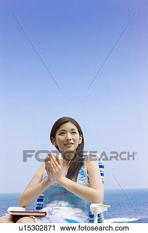 Young woman listening music and holding a teacup View Large Photo Image Stock Image - Young woman listening music and holding a teacup. Fotosearch
