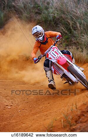 Young man motocross over field. View Large Photo Image Stock Image - Young man motocross over field.. Fotosearch