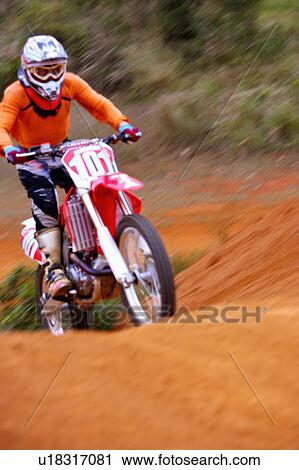 Young man motocross over field. View Large Photo Image Stock Image - Young man motocross over field.. Fotosearch