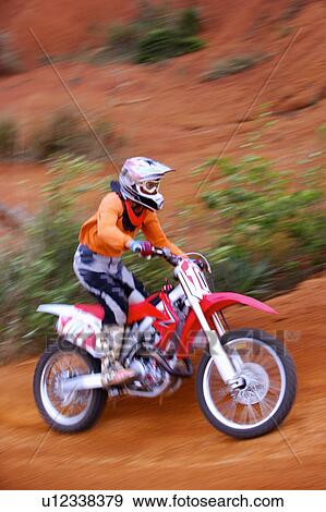 Young man motocross over field. View Large Photo Image Stock Photo - Young man motocross over field.. Fotosearch