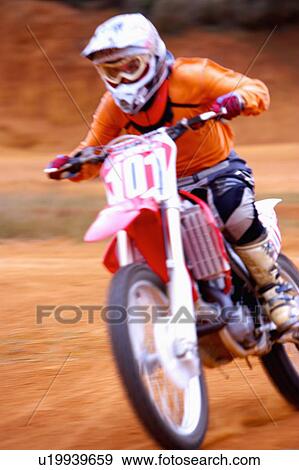 Young man motocross over field. View Large Photo Image Stock Photo - Young man motocross over field.. Fotosearch