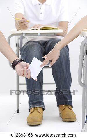 Close-up of hands passing message View Large Photo Image Stock Photograph - Close-up of hands passing message. Fotosearch