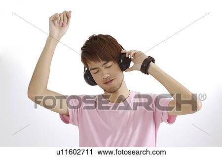 "Teenager boy dancing and listening music, portrait" View Large Photo Image Stock Image - "Teenager boy dancing and listening music, portrait". Fotosearch