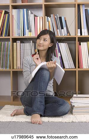 Stock Photography - "Young girl reading book and meditating, portrait". Fotosearch