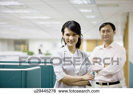 Business people standing with hands on chest View Large Photo Image Stock Photo - Business people standing with hands on chest. Fotosearch