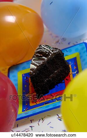 Stock Image - Chocolate cake on party plate. Fotosearch