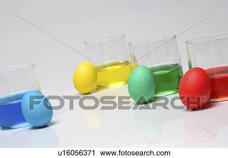 Stock Image - Dyeing Easter eggs. Fotosearch