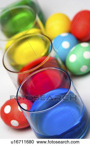 Stock Image - Dyeing Easter eggs. Fotosearch