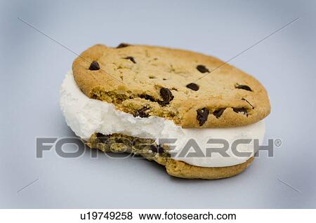 Stock Photo - Ice cream sandwich with bite taken out of it. Fotosearch