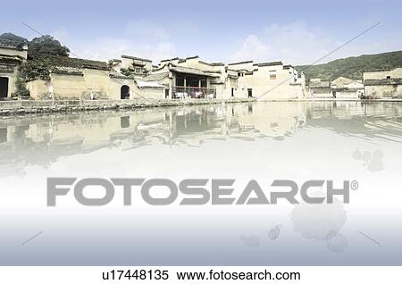 Stock Illustration - Digitally generated, Chinese-styled scenery, of houses beside the lake. Fotosearch