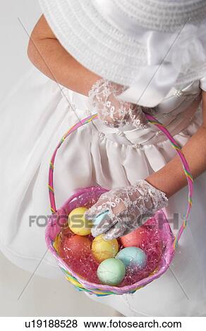 Girl holding Easter basket View Large Photo Image Stock Photo - Girl holding Easter basket. Fotosearch