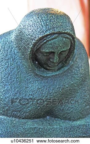 Stock Image - Concrete statue of a woman. Fotosearch