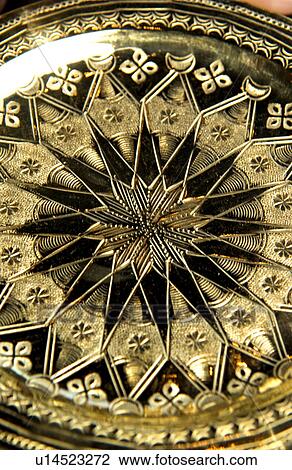 Stock Image - Gold decorative plate. Fotosearch