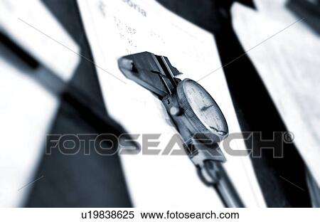 Stock Photography - Caliper pen and pad on work table. Fotosearch
