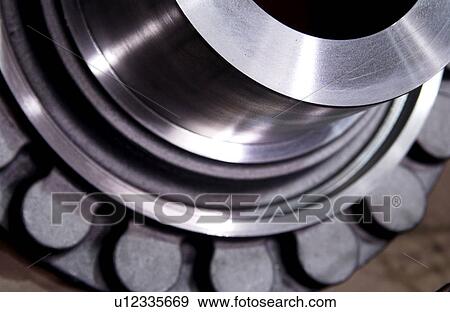 Stock Photo - Detail of metal part in factory. Fotosearch