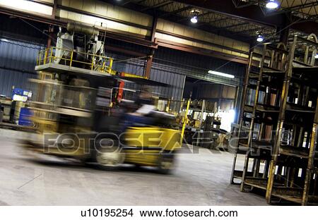 Forklift moving in factory View Large Photo Image Picture - Forklift moving in factory. Fotosearch
