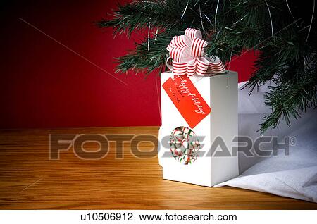 Christmas gift under tree View Large Photo Image Stock Image - Christmas gift under tree. Fotosearch