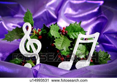 Holly with musical note ornaments View Large Photo Image Stock Image - Holly with musical note ornaments. Fotosearch