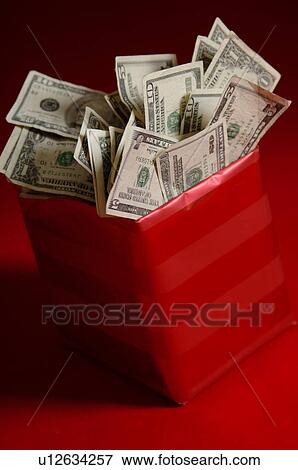 Stock Photo - Money in gift box. Fotosearch