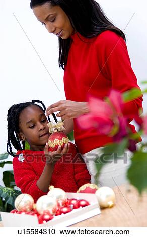 Mother and Daughter with Christmas tree View Large Photo Image Stock Image - Mother and Daughter with Christmas tree. Fotosearch