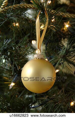 Stock Image - Ornament hanging on Christmas tree. Fotosearch