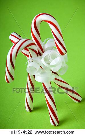 Stock Image - Three candy canes. Fotosearch