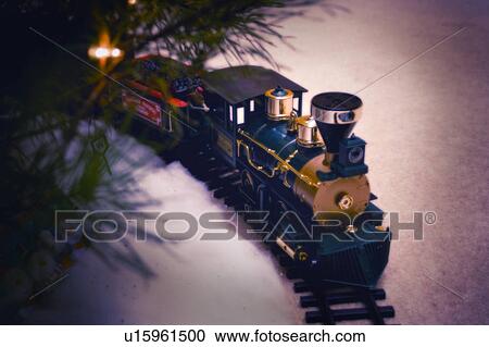 Train under Christmas tree View Large Photo Image Stock Image - Train under Christmas tree. Fotosearch