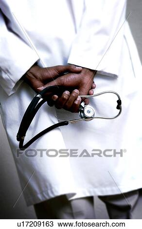 African American doctor holding stethoscope View Large Photo Image Stock Image - African American doctor holding stethoscope. Fotosearch