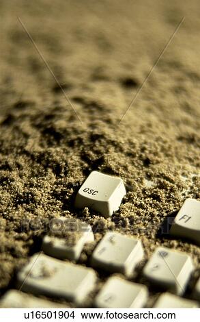 Picture - Keyboard in the sand. Fotosearch