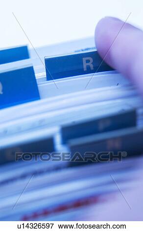 Person looking through card file View Large Photo Image Stock Photo - Person looking through card file. Fotosearch