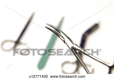 Scalpel and forceps View Large Photo Image Stock Image - Scalpel and forceps . Fotosearch